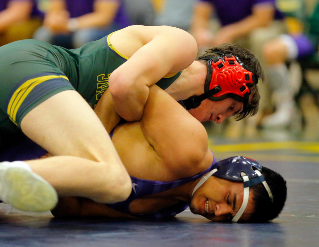 Shorecrest’s Peter Grimm pins Edmonds-Woodway’s Sergio Lopez on Wednesday, Jan. 18, 2023, at Shorecrest High School in Shoreline, Washington. (Ryan Berry / The Herald)
