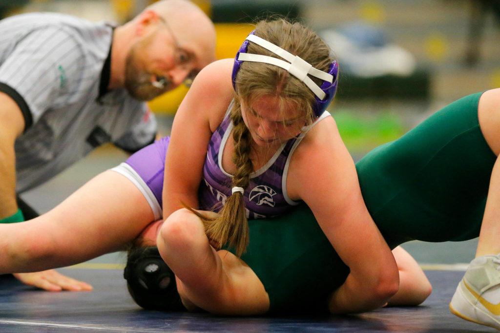 Edmonds-Woodway’s Beckett Tracy pins Shorecrest’s Rebecca Rhodes on Wednesday, Jan. 18, 2023, at Shorecrest High School in Shoreline, Washington. (Ryan Berry / The Herald)
