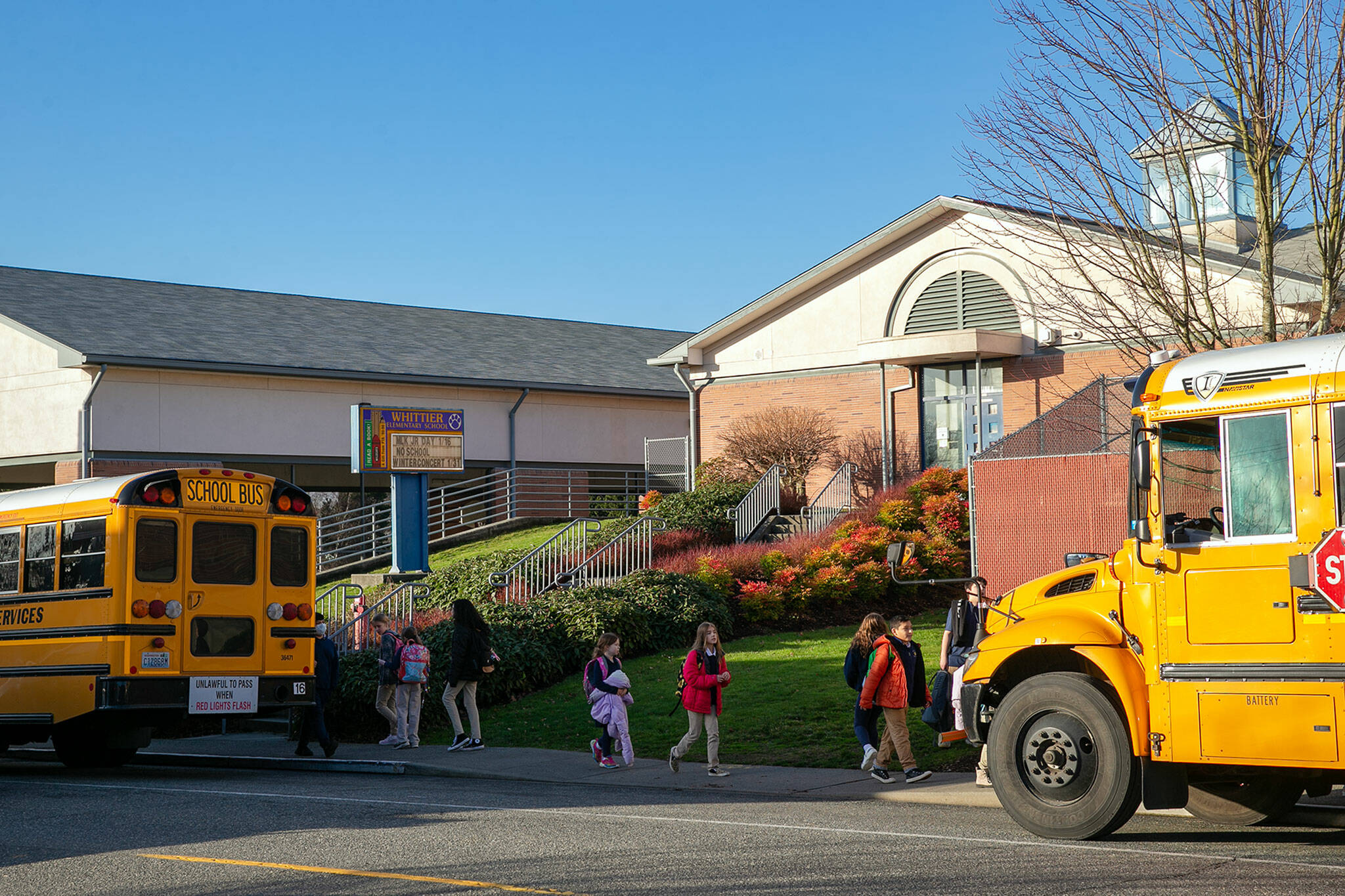 Students head to their buses after class at Whittier Elementary School on Thursday, Jan. 19, 2023, in Everett, Washington. (Ryan Berry / The Herald)