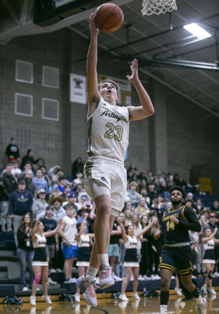 Arlington’s Leyton Martin makes a layup during the game against Shorecrest on Thursday, Jan. 19, 2023 in Arlington, Washington. (Olivia Vanni / The Herald)
