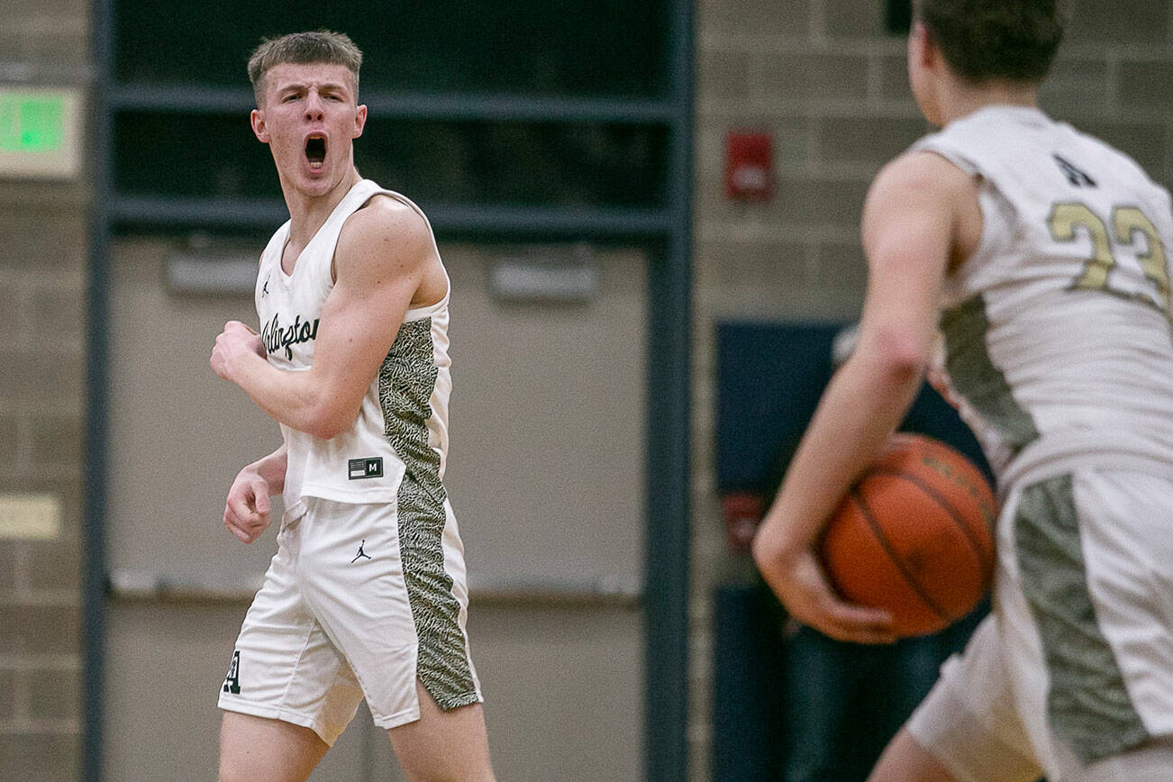 Arlington’s Jackson Trotter reacts to beating Shorecrest on Thursday, Jan. 19, 2023 in Arlington, Washington. (Olivia Vanni / The Herald)