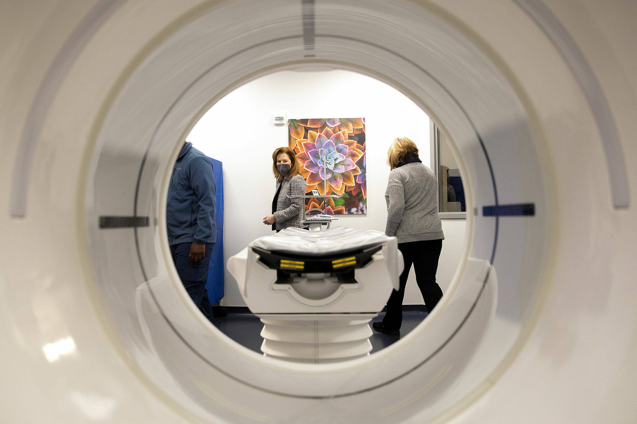 Rep. Kim Schrier walks through a CT scan room with Regional Manager Susan Rushing during a visit to the new VA Puget Sound Health Care System Everett Clinic on Friday, Jan. 20, 2023, in Everett, Washington. The scanner is the first CT at any VA outpatient clinic in the region. (Ryan Berry / The Herald)