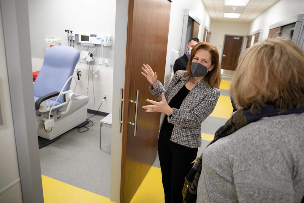 Rep. Kim Schrier speaks with Regional Manager Susan Rushing about a room designated for serving homeless veterans during a visit to the new VA Puget Sound Health Care System Everett Clinic on Friday, Jan. 20, 2023, in Everett, Washington. (Ryan Berry / The Herald)
