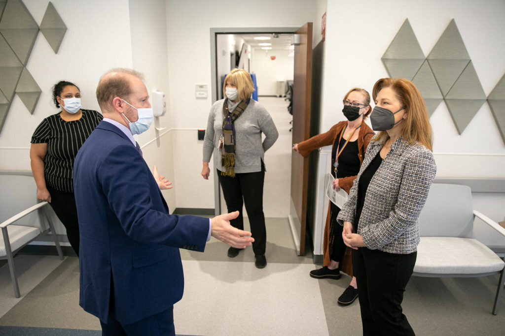 Rep. Kim Schrier, right, speaks with Thomas Bundt, Executive Director of the VA Puget Sound Health Care System, during a visit to the VA system&rsquo;s new Everett Clinic on Friday, Jan. 20, 2023, in Everett, Washington. (Ryan Berry / The Herald)
