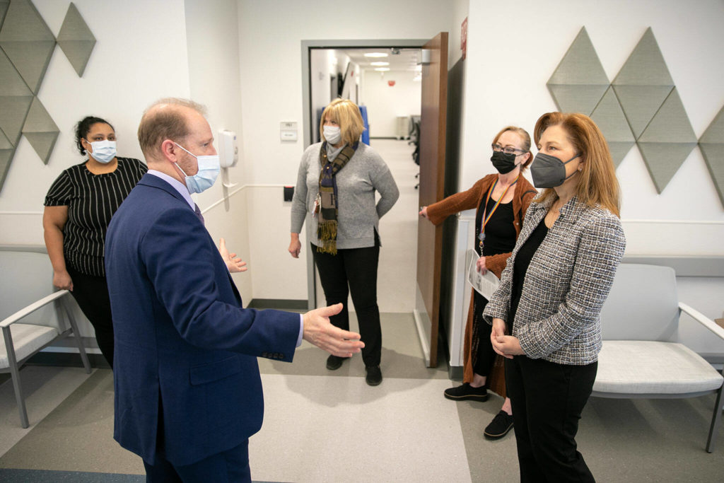 Rep. Kim Schrier, right, speaks with Thomas Bundt, Executive Director of the VA Puget Sound Health Care System, during a visit to the VA system’s new Everett Clinic on Friday, Jan. 20, 2023, in Everett, Washington. (Ryan Berry / The Herald)
