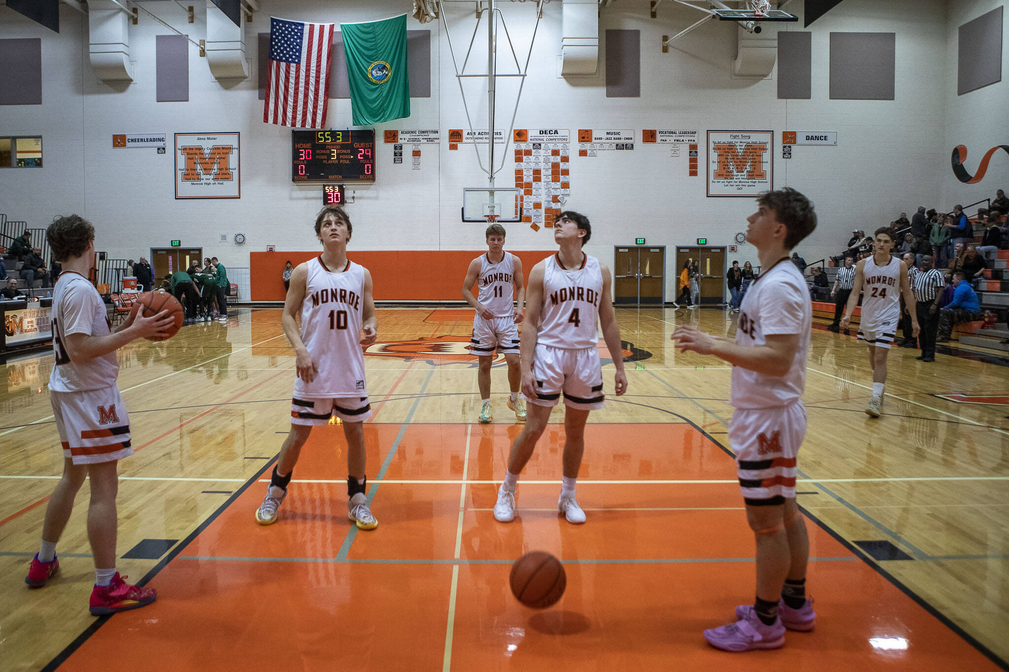 Monroe players warm-up at halftime during a game between the Monroe Bearcats and the Edmonds-Woodway Warriors at Monroe High School in Monroe, on Jan. 20. The Bearcats defeated the Warriors, 68-57. (Annie Barker / The Herald)