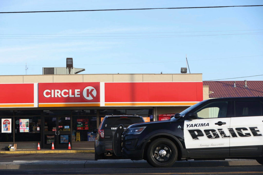 Police cordon off the area around a Circle K convenience store on Nob Hill Boulevard in Yakima, on Tuesday, where people were fatally shot in the early morning. (Emree Weaver / Yakima Herald-Republic via AP)
