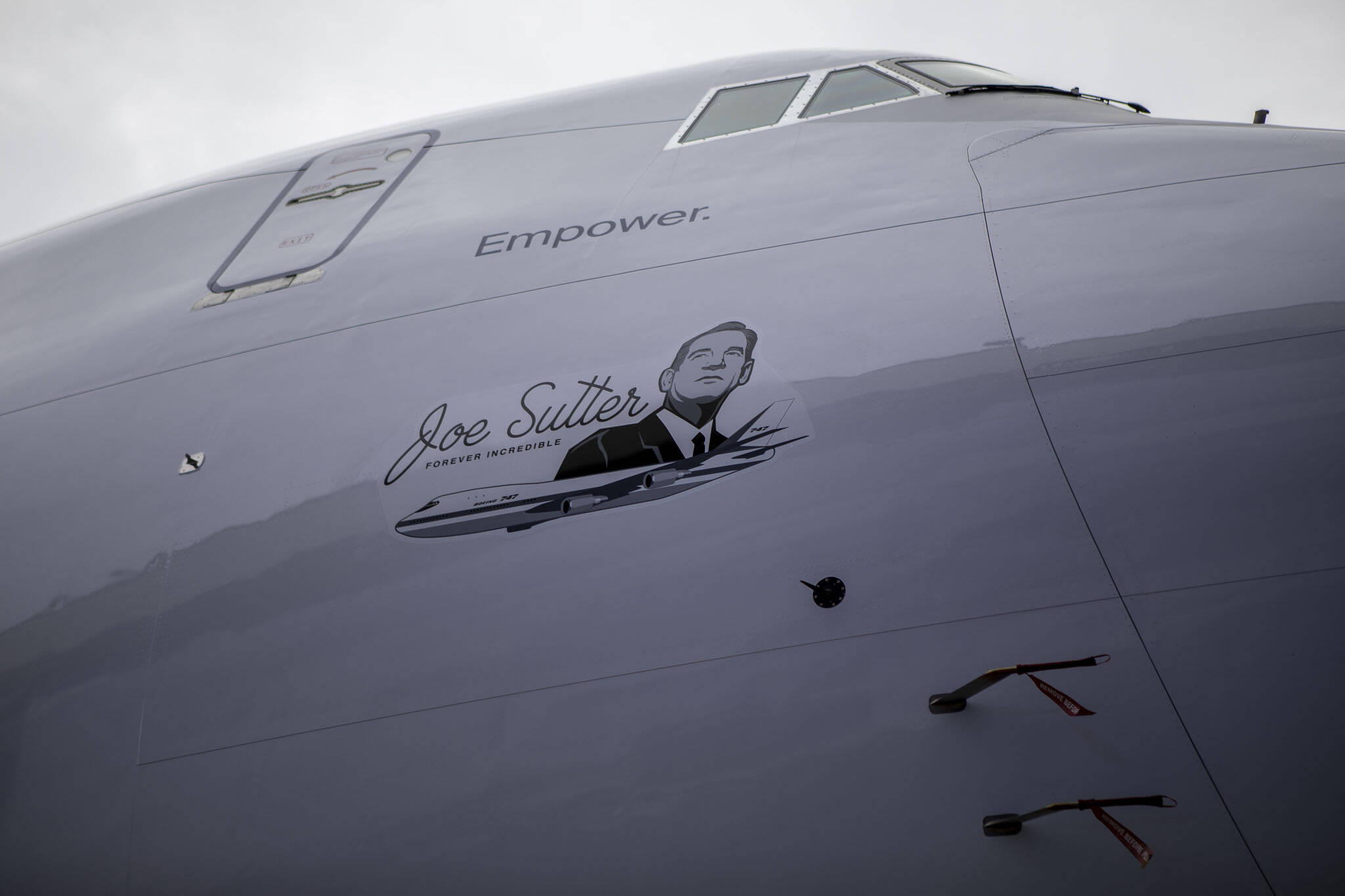 A graphic of Joe Sutter, the 747 program’s chief engineer, sits on the final 747 during a celebration on Tuesday, in Everett. (Annie Barker / The Herald)