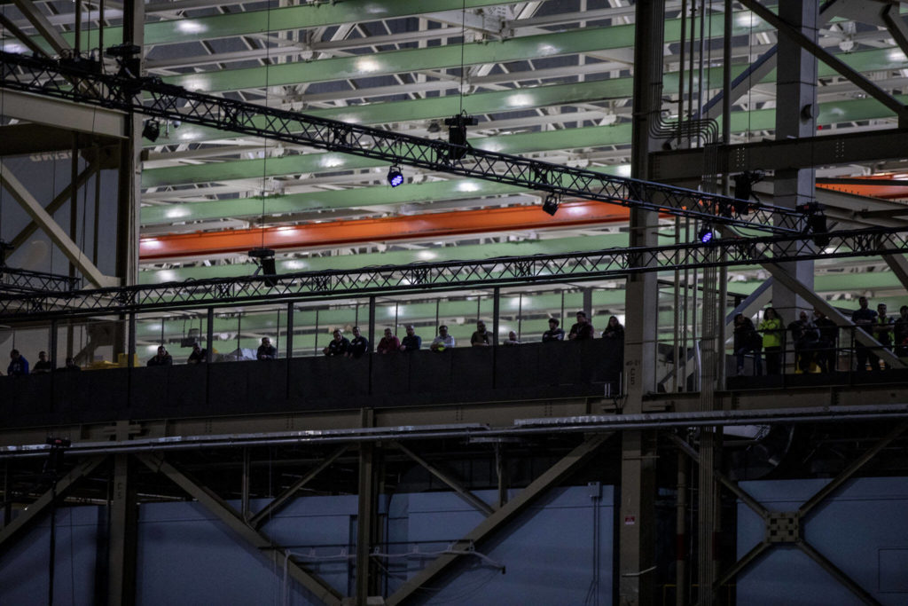 Workers listen and watch during a 747 celebration on Tuesday, in Everett. (Annie Barker / The Herald)
