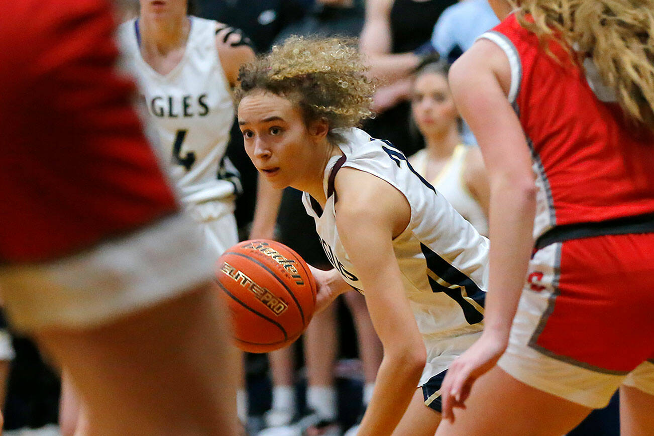 Arlington’s Samara Morrow looks to cut to the basket against Stanwood on Wednesday, Jan. 25, 2023, at Arlington High School in Arlington, Washington. (Ryan Berry / The Herald)