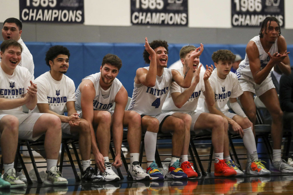 EC players cheer during a men’s game between the Everett Community College Trojans and Edmonds College Tritons at Seaview Gymnasium at Edmonds College in Lynnwood, Washington on Wednesday Jan. 25, 2023. The Tritons won, 91-84. (Annie Barker / The Herald)
