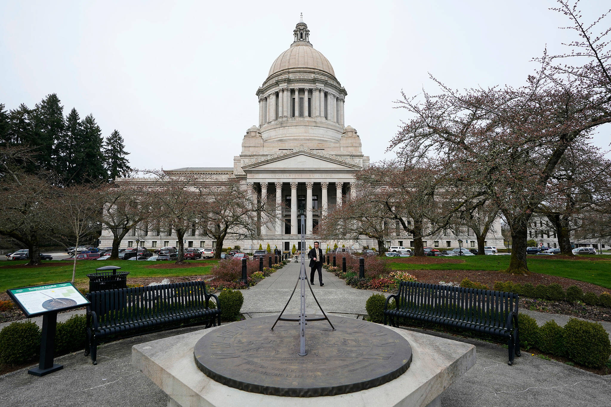 The sun dial near the Legislative Building is shown under cloudy skies, March 10, 2022, at the state Capitol in Olympia.(AP Photo/Ted S. Warren, File)