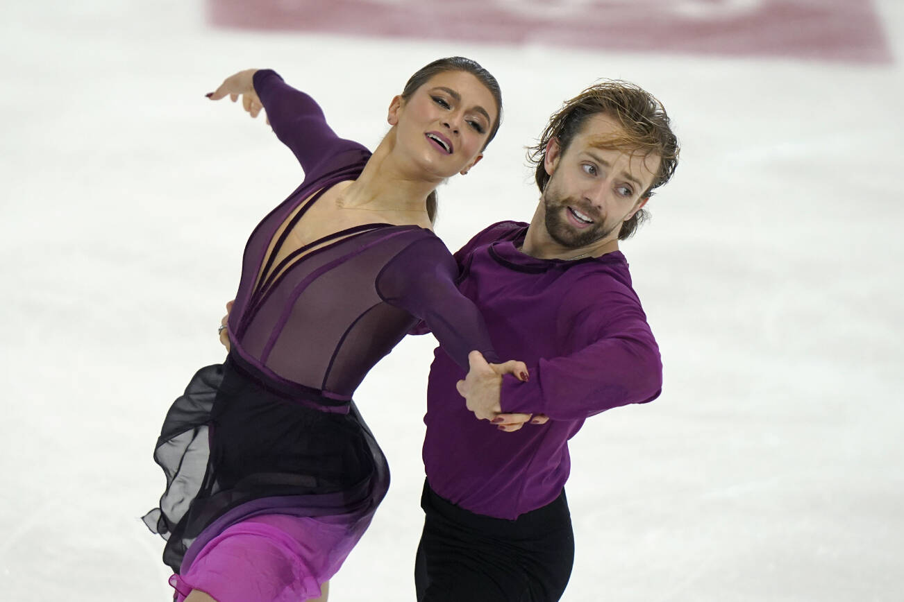 Kaitlin Hawayek, left, and Jean-Luc Baker, of the United States, perform during the Ice Dance Free Dance program at the Grand Prix Skate America Series, Sunday, Oct. 23, 2022, in Norwood, Mass. (AP Photo/Steven Senne)