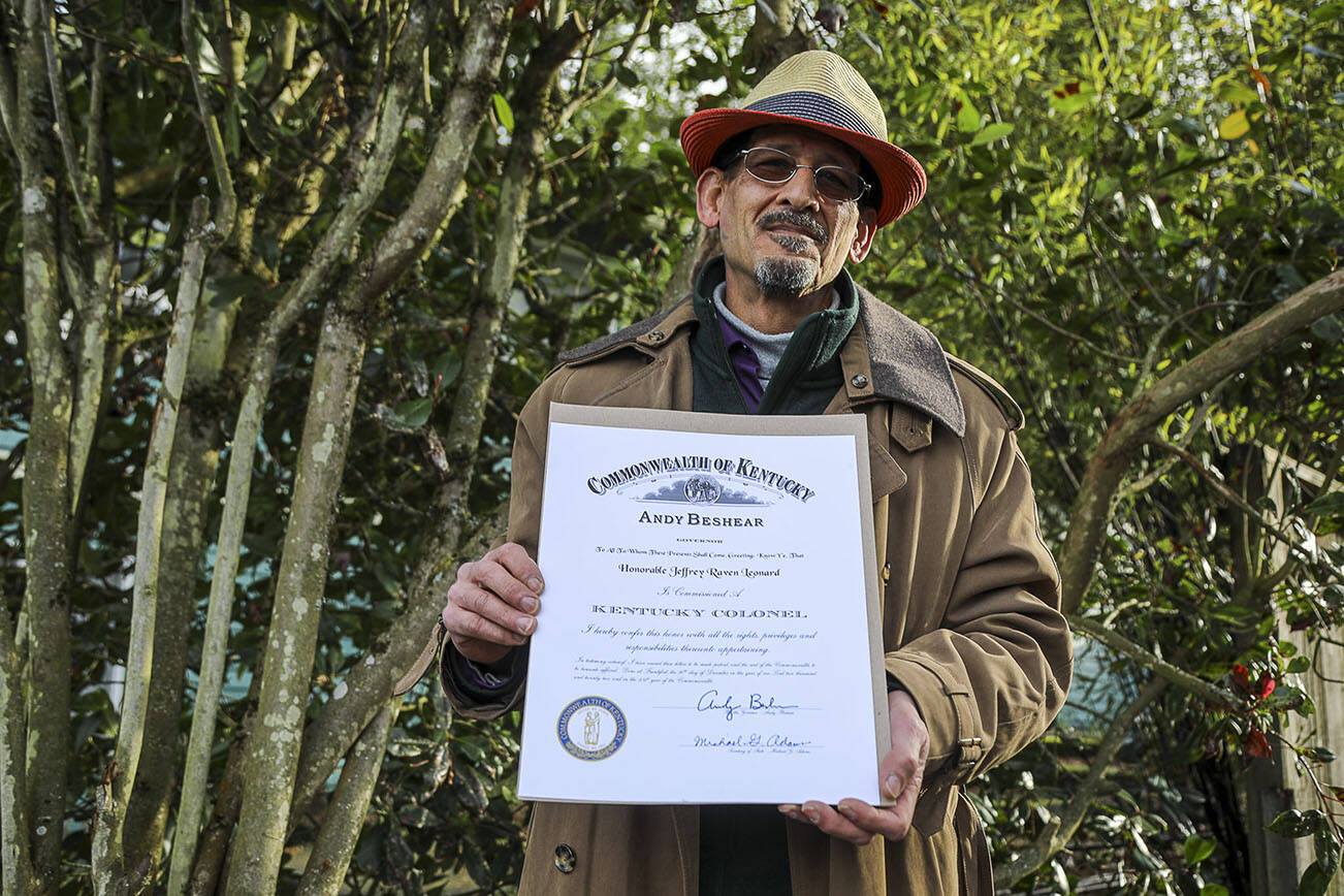 Everett Home Depot worker Jeffrey Raven Leonard, 52, holds a certificate that names him a Kentucky Colonel, an honor from the governor of Kentucky. He received the award, given to 4,000 to 5,000 people annually, for getting the word out about a hiring program for veterans at Home Depot. (Annie Barker / The Herald)