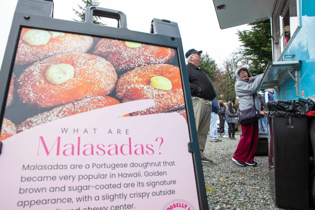 Alice Tum’s speciality is malasadas, a doughnut-like Portuguese confection that’s popular in Hawaii. (Ryan Berry / The Herald)
