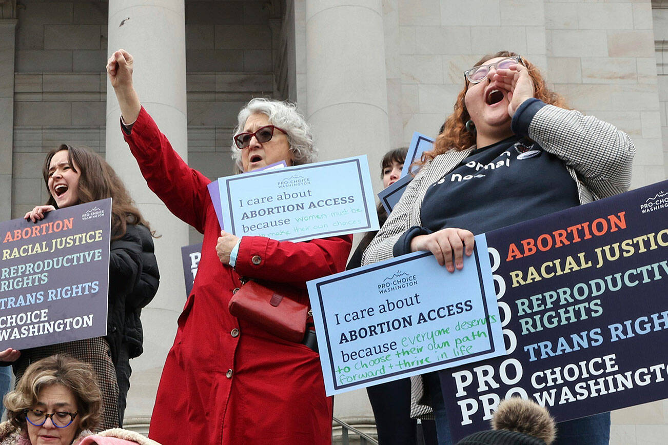 People cheer during an abortion rights rally at the State Capitol in Olympia, Wash, Tuesday,  Jan. 24, 2023. (Karen Ducey/The Seattle Times via AP)