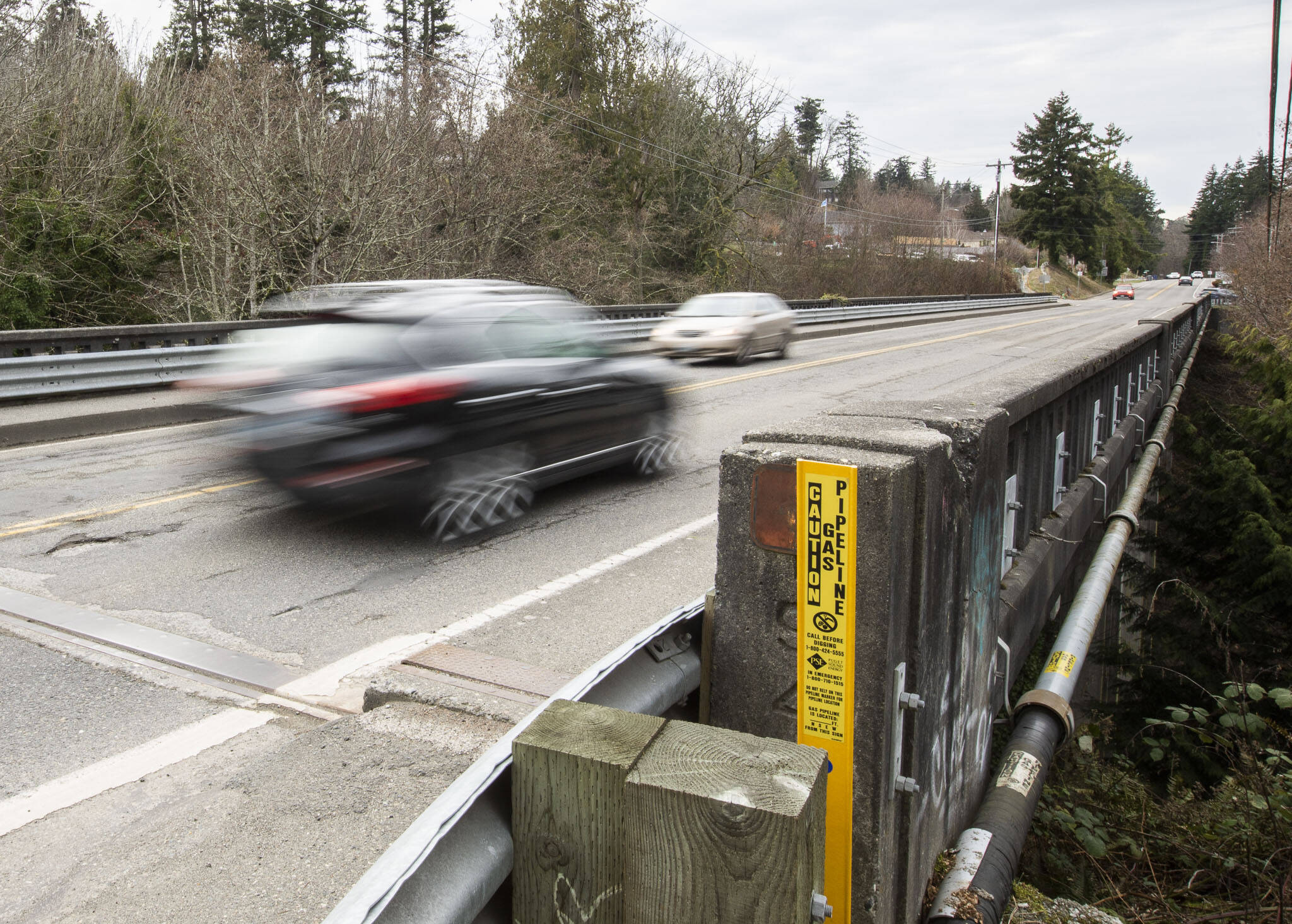 Traffic moves across Edgewater Bridge between Everett and Mukilteo on Tuesday in Everett. The bridge is set to be replaced this summer. (Olivia Vanni / The Herald)