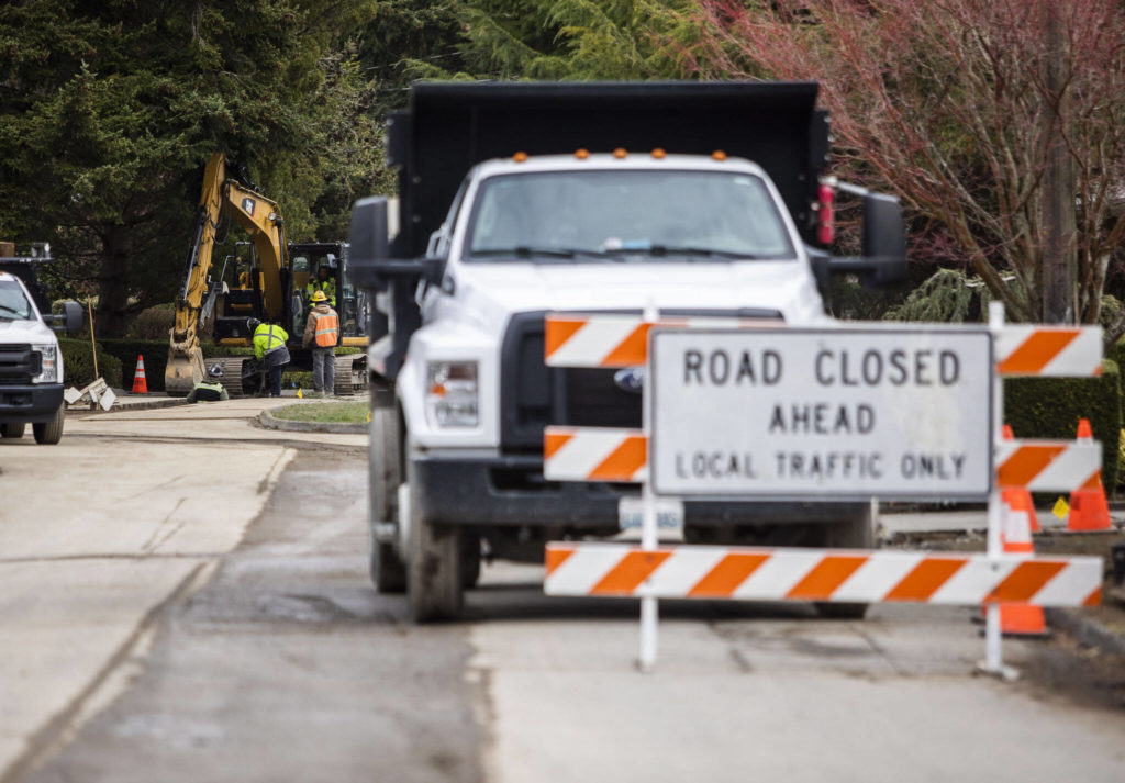 Signs alert drivers to construction Tuesday along Shore Avenue in Mukilteo. (Olivia Vanni / The Herald)
