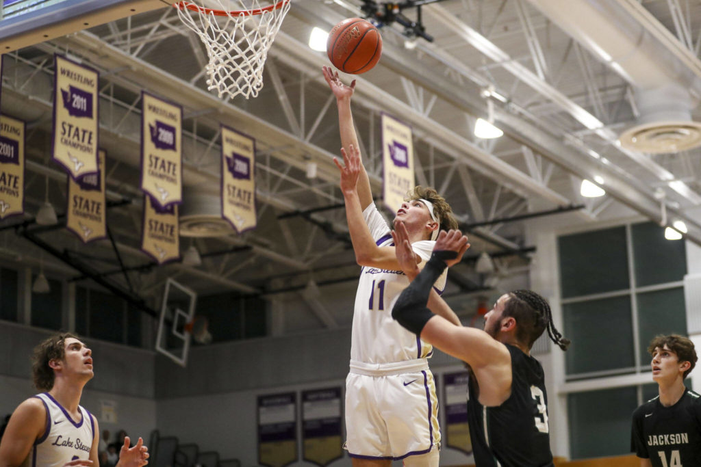 Lake Stevens’ Easton Gosser (11) shoots the ball during a game against Jackson in Lake Stevens on Tuesday. Jackson won 87-69. (Annie Barker / The Herald)
