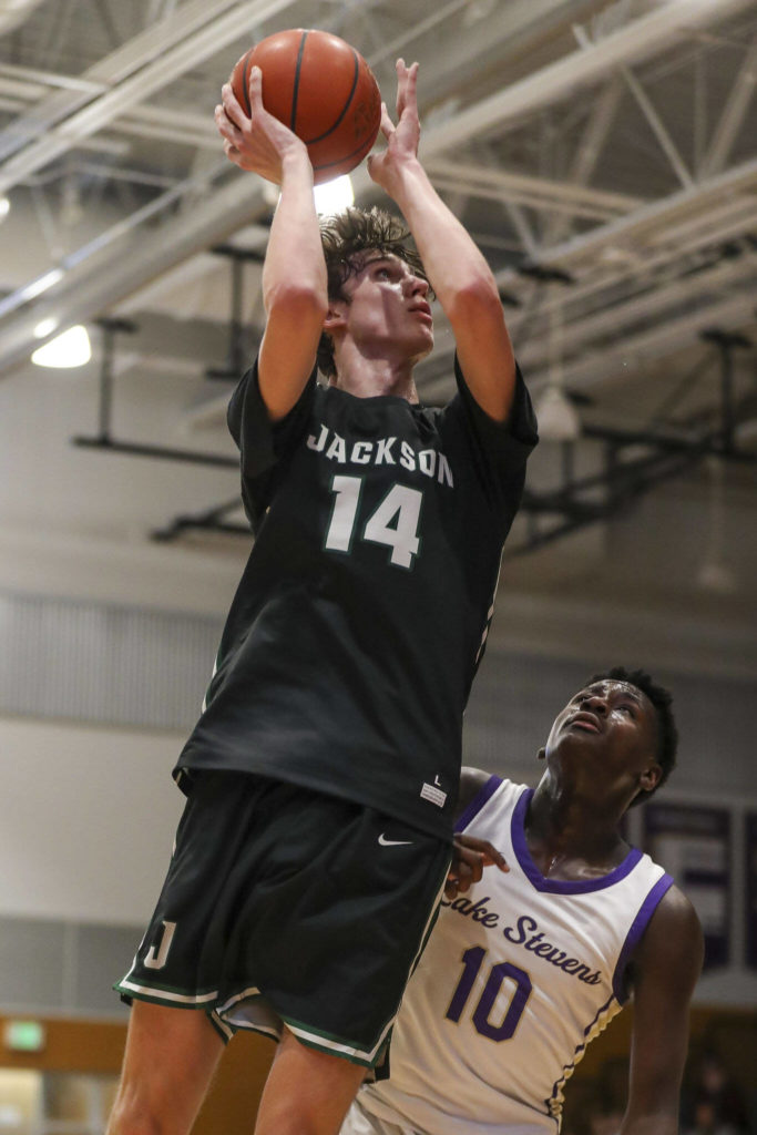 Jackson’s Ryan Mcferran (14) shoots the ball during a game against Lake Stevens on Tuesday in Lake Stevens. Jackson won 87-69. (Annie Barker / The Herald)
