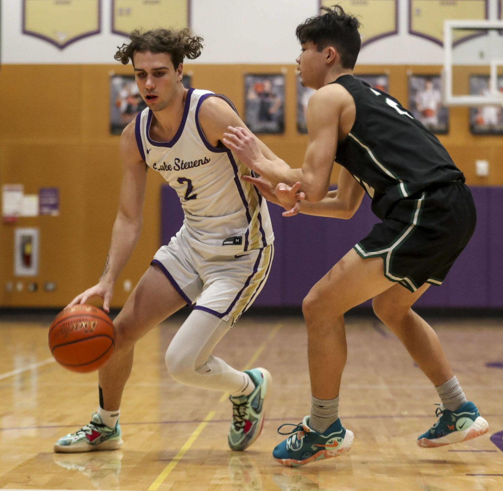 Lake Stevens’ Tyson Eyman (2) moves with the ball during a game against Jackson on Tuesday in Lake Stevens. Jackson won 87-69. (Annie Barker / The Herald)
