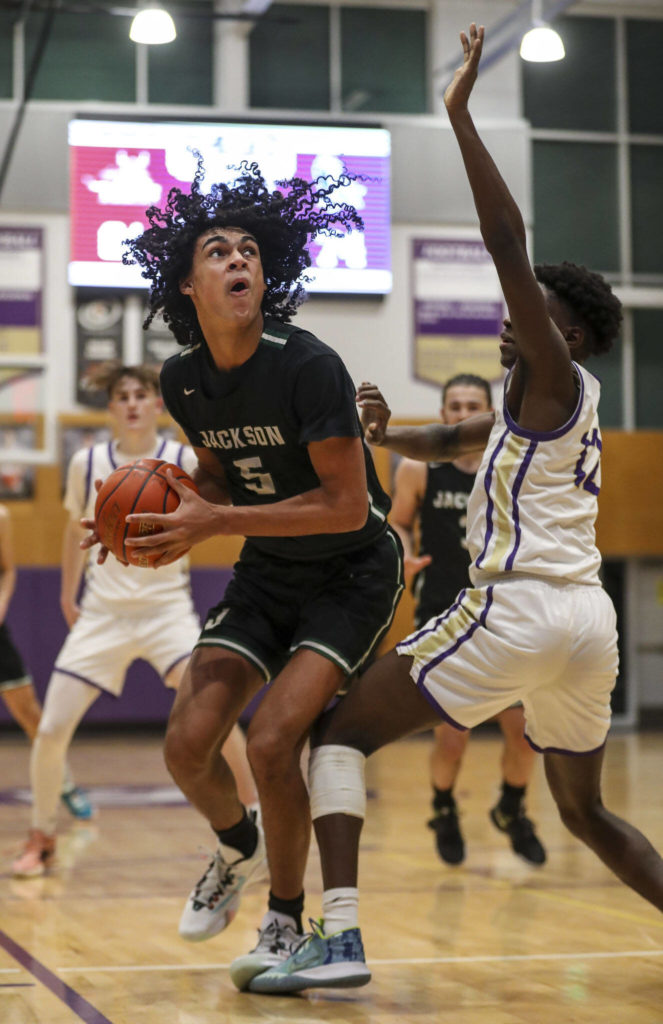 Jackson’s Sylas Williams (5) shoots the ball during a game against Lake Stevens on Tuesday in Lake Stevens. Jackson won 87-69. (Annie Barker / The Herald)
