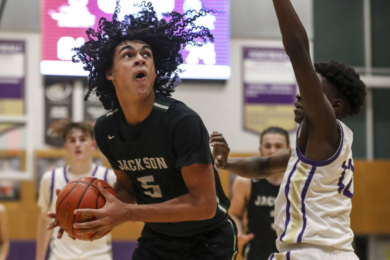 Jackson’s Sylas Williams (5) shoots the ball during a game between Lake Stevens and Jackson at Lake Stevens High School in Lake Stevens, Washington on Tuesday, Jan. 31, 2023. The Jackson Timberwolves won, 87-69. (Annie Barker / The Herald)