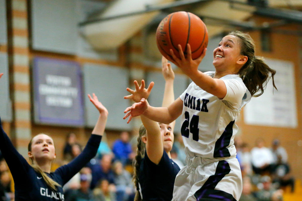 Kamiak’s Bella Hasan hits an acrobatic layup in the final moments of a game against Glacier Peak on Wednesday, Feb 1, 2023, at Kamiak High School in Mukilteo, Washington. (Ryan Berry / The Herald)

