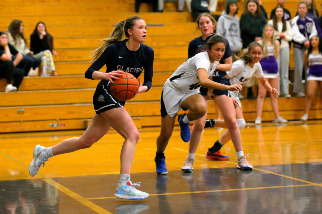 Glacier Peak’s Kylani Rookstool turns the ball back the other way after pulling down a rebound against Kamiak on Wednesday, Feb 1, 2023, at Kamiak High School in Mukilteo, Washington. (Ryan Berry / The Herald)

