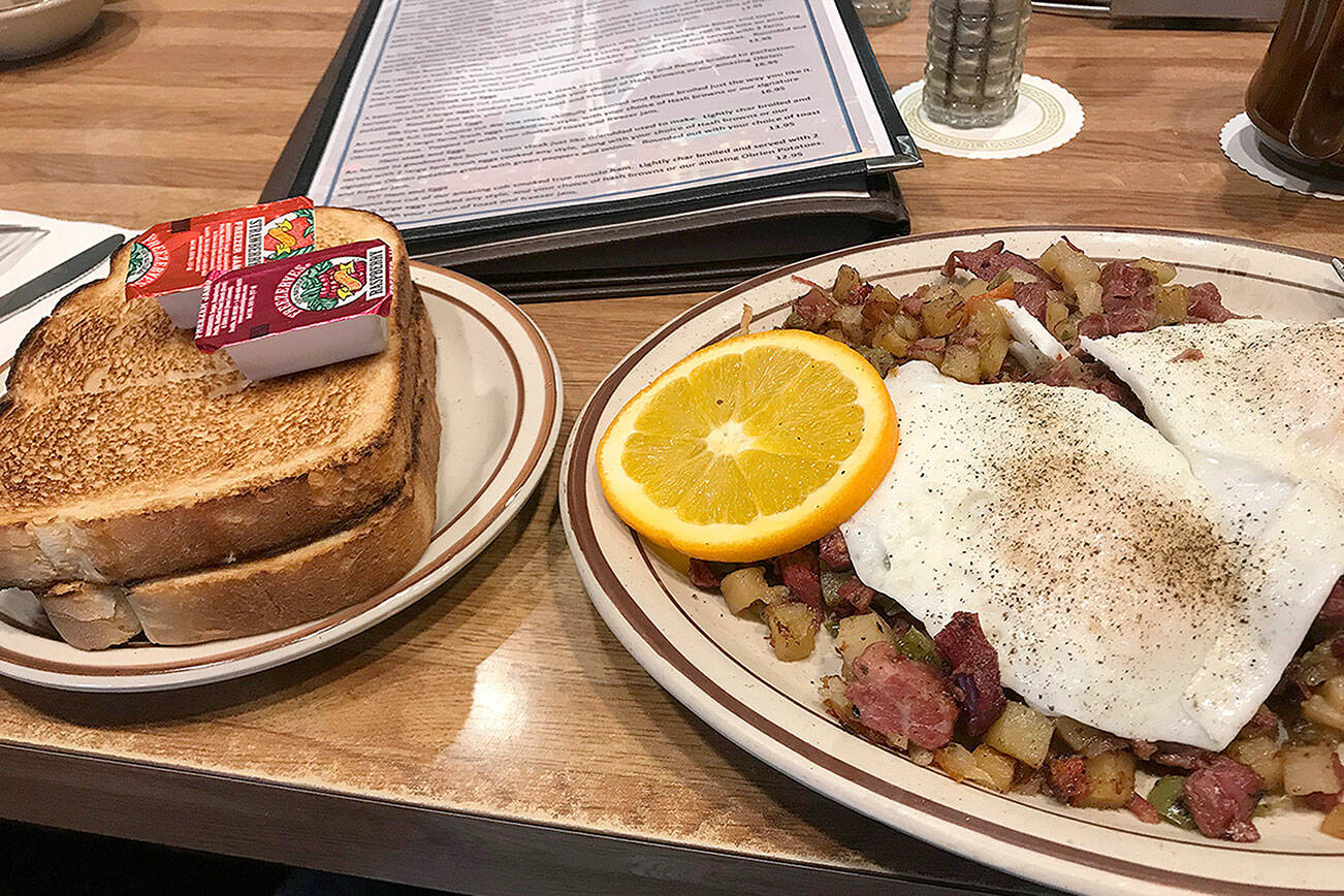 The Totem hash -- corned beef, potatoes and onions, topped with fried eggs -- at Totem Family Diner in Everett, (Mark Carlson / The Herald)
