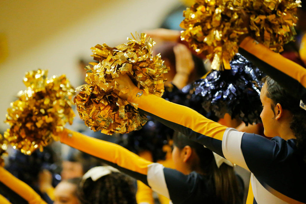The Mariner cheerleaders hold up their poms for a free throw during a game against Lake Stevens on Thursday, Feb. 2, 2023, at Mariner High School in Everett, Washington. (Ryan Berry / The Herald)
