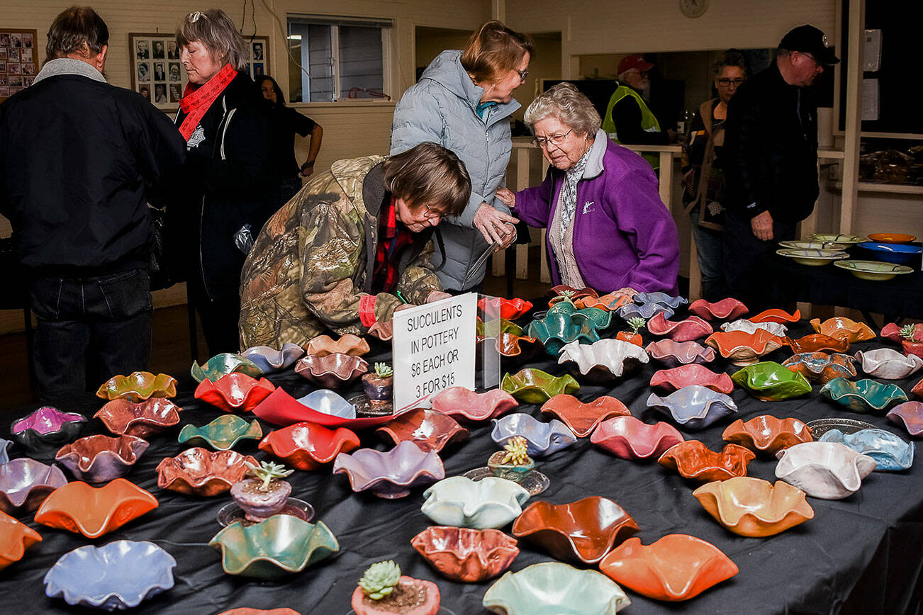 People look through a selection of bowls available at the Granite Falls Food Bank’s Empty Bowl fundraiser on Saturday, Feb. 11, 2023 in Granite Falls, Washington. (Photo courtesy of Cheri Moss)