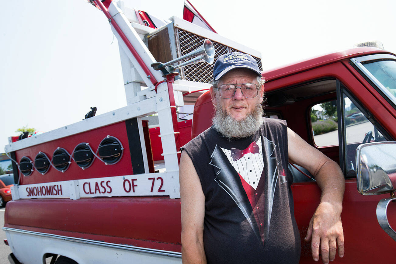 After his 40th Snohomish High School Class of 1972 reunion, Mike Carver decked out his 1967 Ford truck with signs and Panther flags to show his pride. He drove it around town and in parades, blasting music from 18 speakers and trailing bubbles. This photo is from 2018. (Andy Bronson / The Herald)