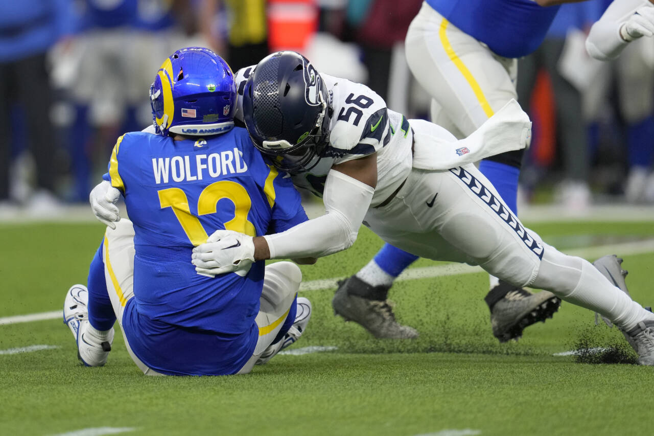 Los Angeles Rams quarterback John Wolford is sacked by Seattle Seahawks linebacker Jordyn Brooks during the second half of a game Dec. 4, 2022, in Inglewood, Calif. (AP Photo/Marcio Jose Sanchez)
