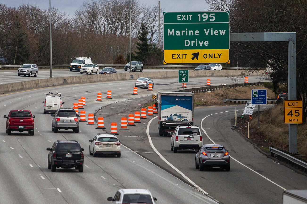 Orange traffic barrels direct drivers away from a section of I-5 that recently buckled causing major traffic backups along the interstate on Tuesday, Jan. 17, 2023 in Everett, Washington. (Olivia Vanni / The Herald)