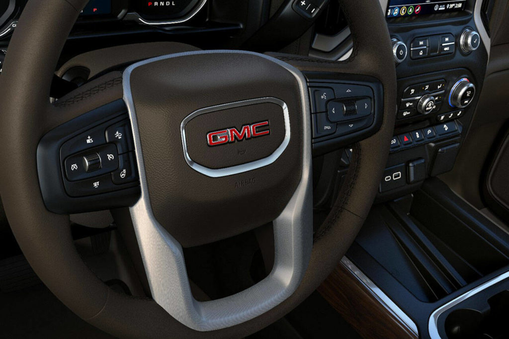 Large buttons and knobs for the infotainment and climate control systems make operation easy even with gloved hands. (GMC)
