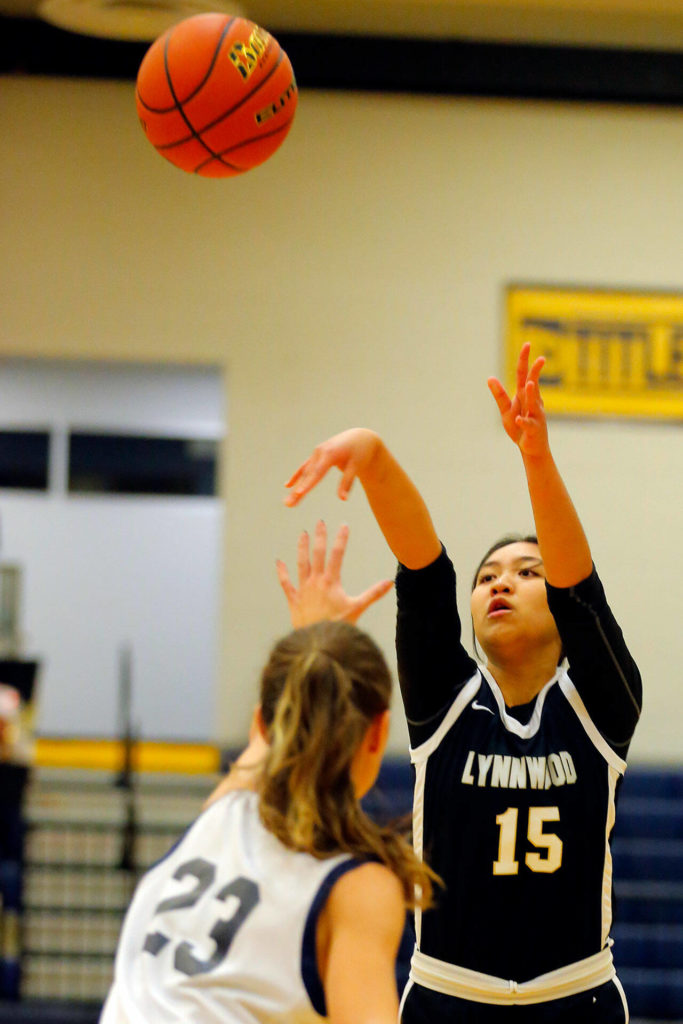 Lynnwood’s Jocelyn Tamayo connects on a three point shot against Everett on Thursday, Dec. 15, 2022, at Norm Lowery Gymnasium in Everett, Washington. (Ryan Berry / The Herald)
