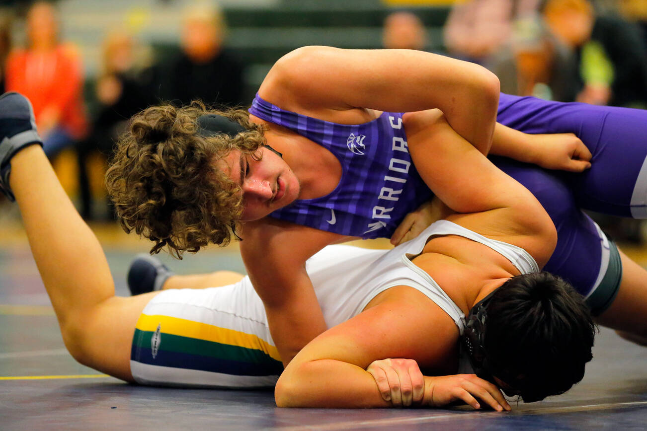 Edmonds-Woodway’s Mika Serafinas controls Shorecrest’s Mateo Dominguez before winning with a pin on Wednesday, Jan. 18, 2023, at Shorecrest High School in Shoreline, Washington. (Ryan Berry / The Herald)