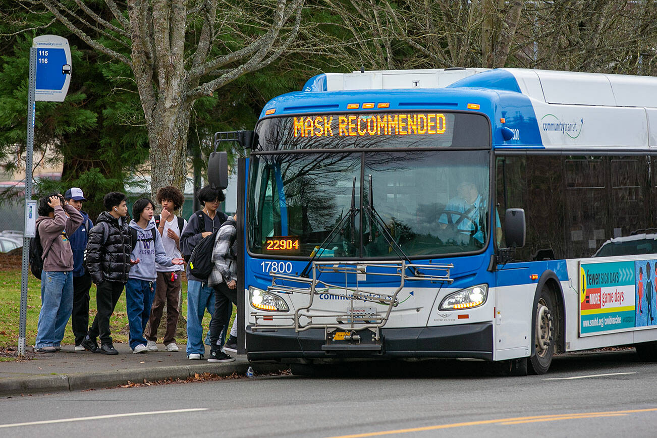 Students load onto the 116 Community Transit bus after school on Friday, Jan. 6, 2023, in front of Edmonds-Woodway High School in Edmonds, Washington. (Ryan Berry / The Herald)