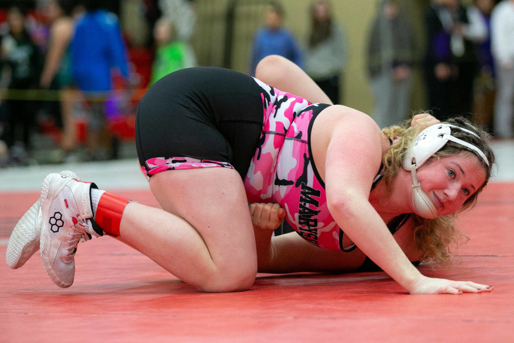 Marysville Pilchuck’s Alivia White calmly pins her opponent within 30 seconds during the 3A/4A Girls Region 1 Wrestling Tournament on Saturday, Feb. 11, 2023, at Snohomish High School in Snohomish, Washington. (Ryan Berry / The Herald)
