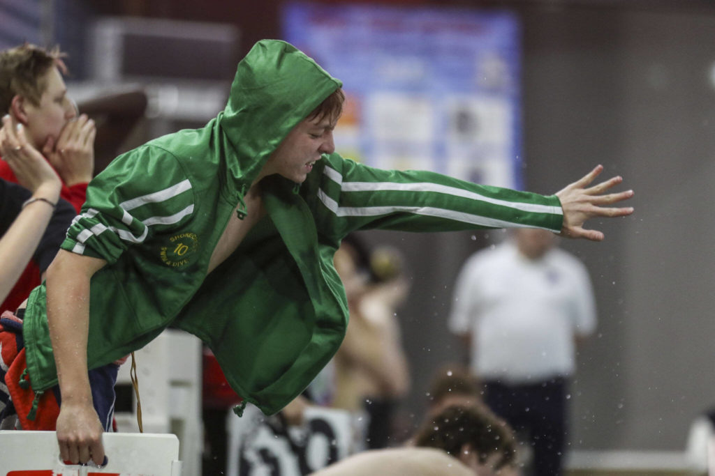 A swimmer cheers during the 3A District 1 swim and dive championships at Snohomish Aquatic Center, in Snohomish, Washington on Saturday, Feb. 11, 2023. (Annie Barker / The Herald)
