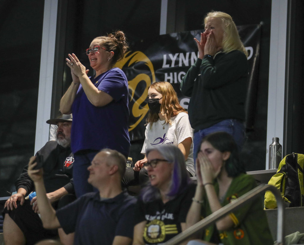 Attendees cheer during the 3A District 1 swim and dive championships at Snohomish Aquatic Center, in Snohomish, Washington on Saturday, Feb. 11, 2023. (Annie Barker / The Herald)
