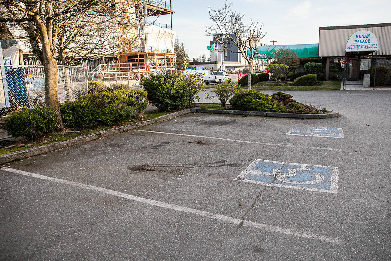 Handicap parking spaces outside of Hunan Palace Restaurant & Lounge on Wednesday, Feb. 15, 2023 in Everett, Washington. (Olivia Vanni / The Herald)