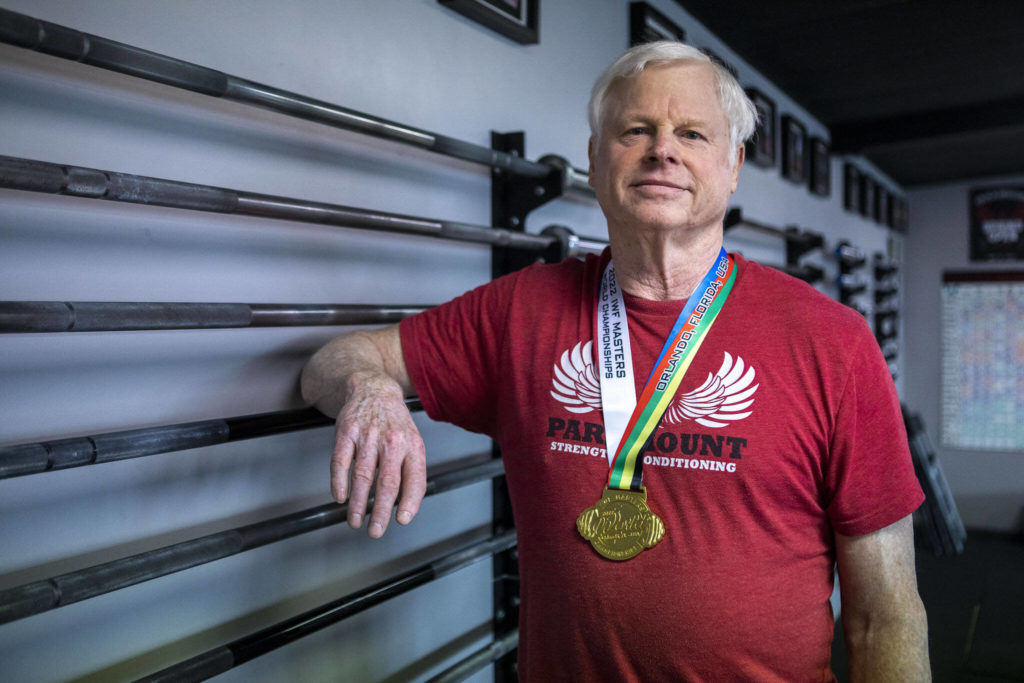 Phil Arnold, 74, practices his lifting techniques at Paramount Strength and Conditioning in Mountlake Terrace, Washington on Thursday, Feb. 2, 2023. The Edmonds resident is 74 and recently retired as an attorney. He took up weightlifting after retirement and recently won a national championship. (Annie Barker / The Herald)
