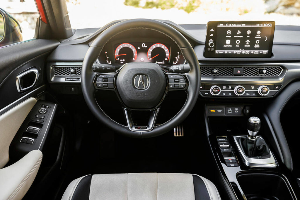 Three large climate control knobs in the 2023 Acura Integra provide a nice tactile experience as they click while being turned. (Acura)
