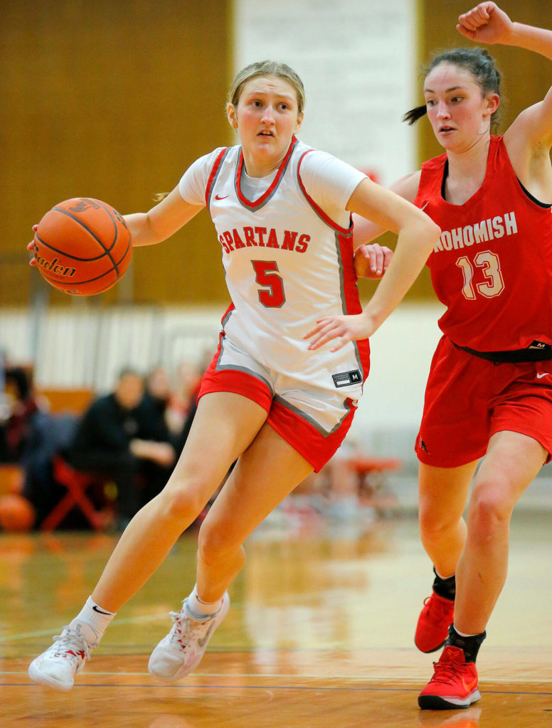Stanwood’s Ava Depew drives to the basket in a win over Snohomish on Tuesday, Feb. 14, 2023, at Marysville Pilchuck High School in Marysville, Washington. (Ryan Berry / The Herald)
