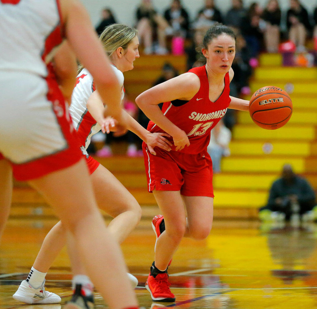Snohomish’s Sienna Capelli pushes the ball past half court against Stanwood on Tuesday, Feb. 14, 2023, at Marysville Pilchuck High School in Marysville, Washington. (Ryan Berry / The Herald)
