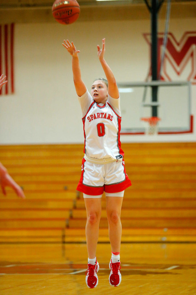 Stanwood’s Grace Walker hits a three in a win over Snohomish on Tuesday, Feb. 14, 2023, at Marysville Pilchuck High School in Marysville, Washington. (Ryan Berry / The Herald)
