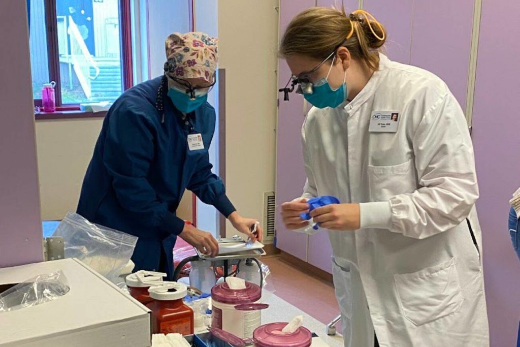 Dr. Jill Tyler prepares supplies to screen kids and apply sealants at Discovery Elementary School in Everett on Feb. 7. (Mukilteo School District)
