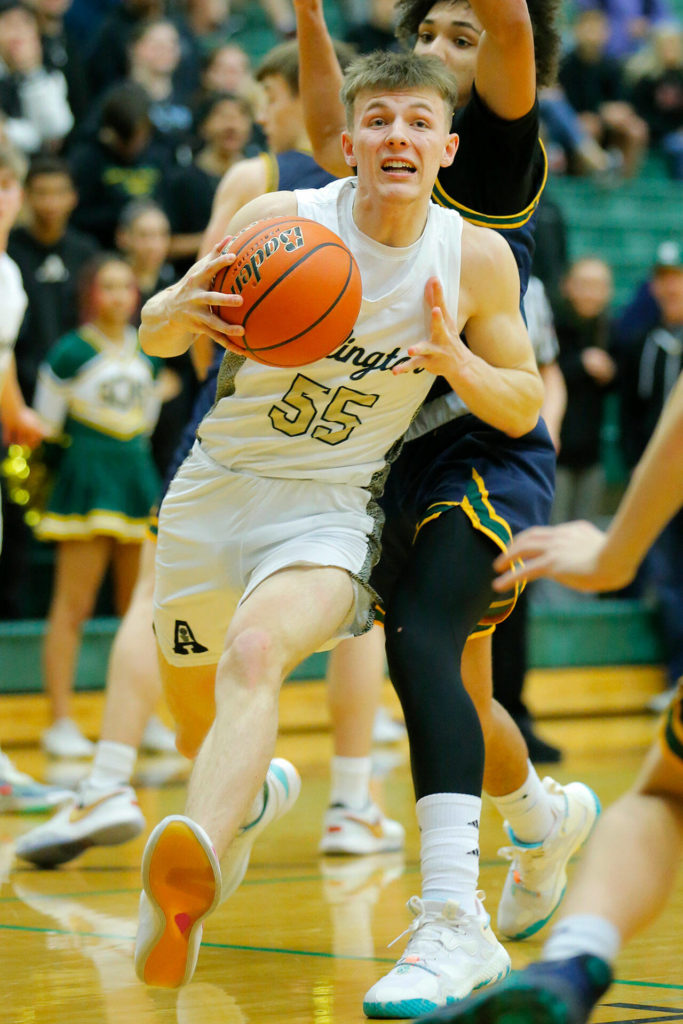 Arlington’s Jackson Trotter takes the ball to the basket against Shorecrest on Wednesday, Feb. 15, 2023, at Jackson High School in Mill Creek, Washington. (Ryan Berry / The Herald)
